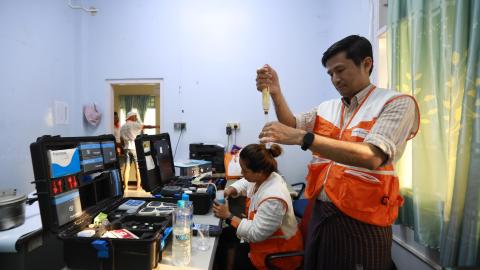Staff testing water quality at Tada-U office