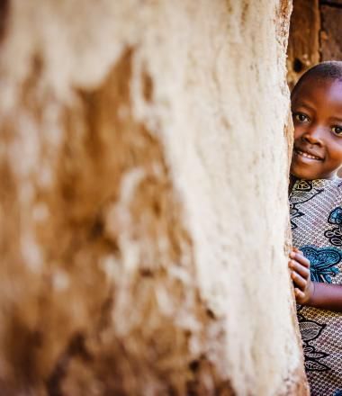 Child smiling in traditional clothing