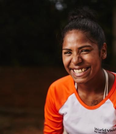 A World Vision Colombia employee smiles at a park