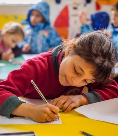 Lebanese girl doing schoolwork in a classroom
