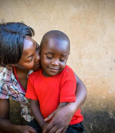 A mother holds her child