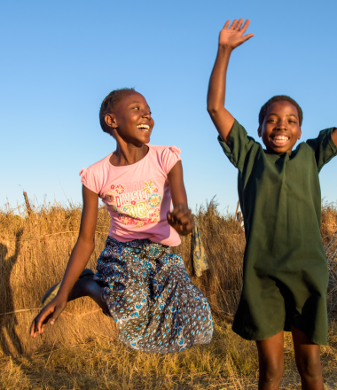 Two girls jumping