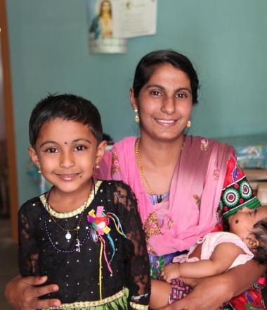 Mother with child and infant