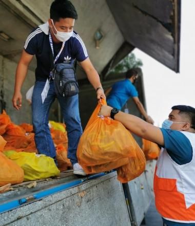 World Vision staff with emergency supplies