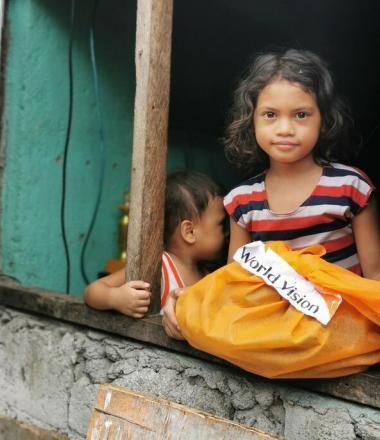 Young girl given relief supplies during COVID-19