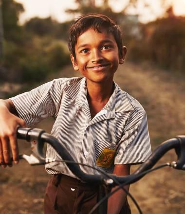 A world of firsts child with bicycle