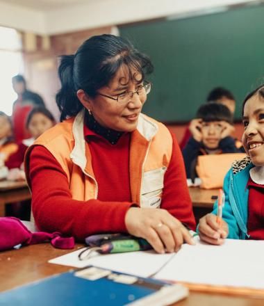 World Vision staff with a child