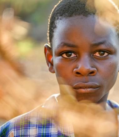 boy standing outside in Africa