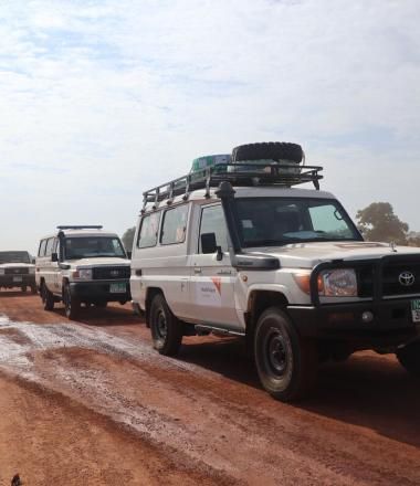 The Shrinking Humanitarian Space, World Vision vehicles in Convoy