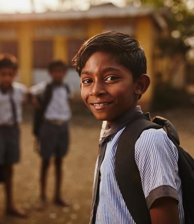 Boy with backpack in Asia