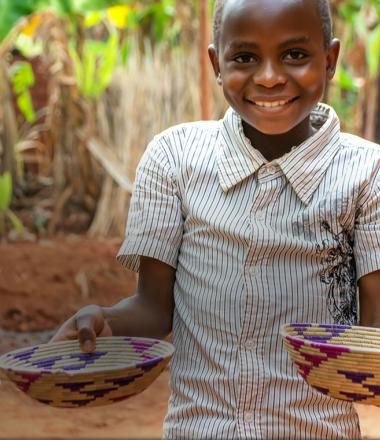 Christmas of firsts key art_child with hands full of food for the first time in a long time