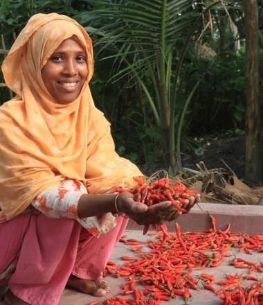 Women's economic empowerment - woman holding chillies