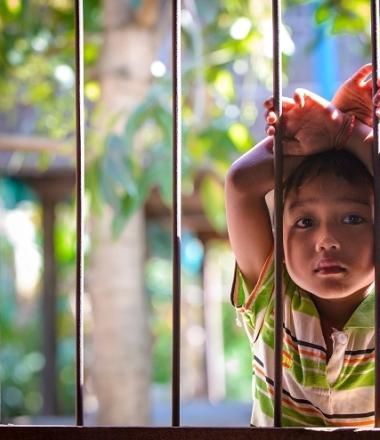 Young boy outside childrens club Cambodia