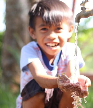 child washing his hands