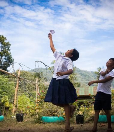 two children play in school yard