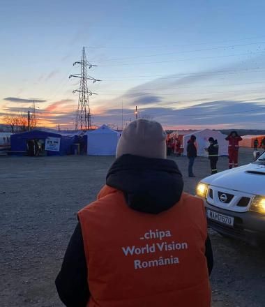 wv volunteer looks over refugee camp