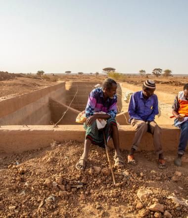 WVI staff speaks with villagers