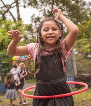 little girl hula hoops