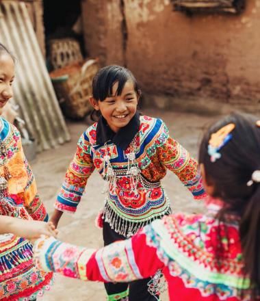 Children dance in traditional clothes in China