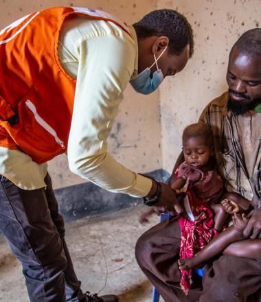 Father helps his children receive healthcare