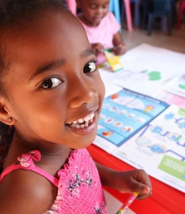 Ihlali and her drawing book which was funded by the Lego Foundation