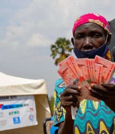 Ugandan women reached with cash assistance in Uganda Refugee Camp.