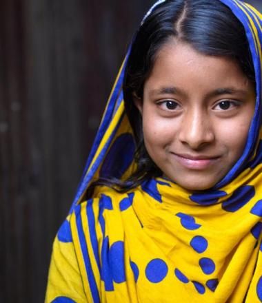 child with headscarf