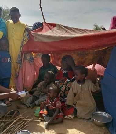 Children fleeing conflict in Sudan take refuge in temporary shelter