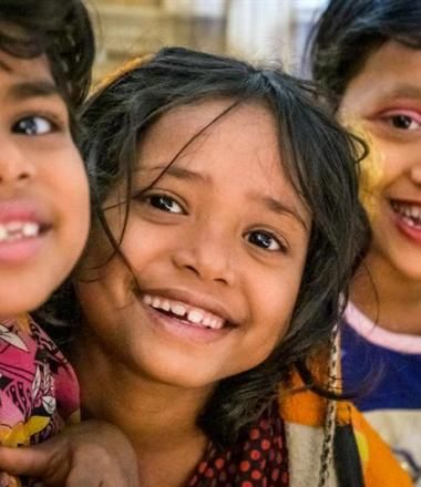 Three children smiling