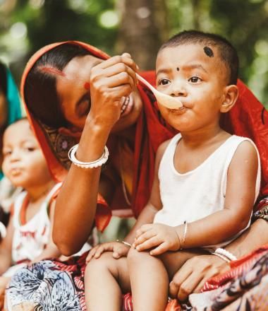 Mother feeding child