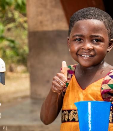 happy child with access to clean water