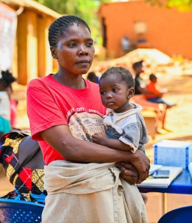 Mother with child in her arms in DRC 
