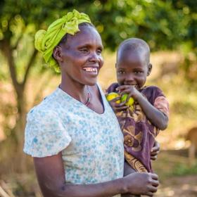 An African woman holds her child