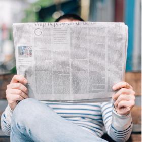 A man reads the newspaper