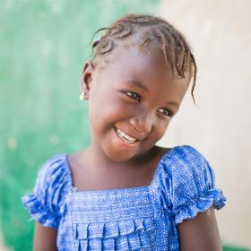 Girl smiling in blue shirt