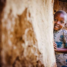 Child smiling in traditional clothing