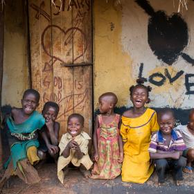 A group of children in front of a house