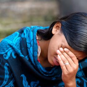 Lucky cries as she shares her story in Bangladesh