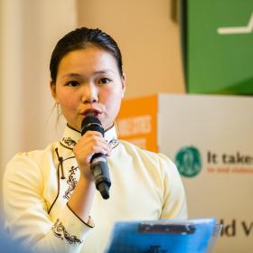 A child speaks at a conference