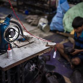 Jatin, 13, works in a textile factory in India
