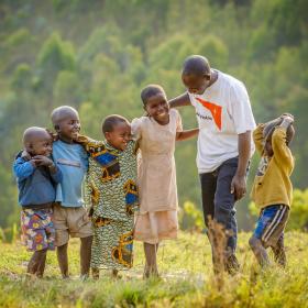 World Vision staff with children