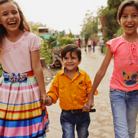 Children walking and holding hands