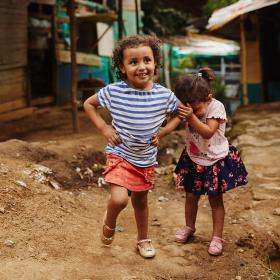 A girl and her sister play in rural Colombia