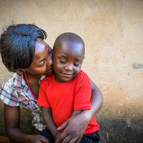 A mother holds her child