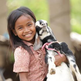 Khmer girl holding goat