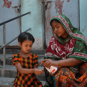 Mother and daughter washing hands during covid-19 response