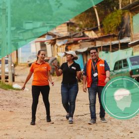 Mindsets and behaviours, world vision staff walking on road in Colombia