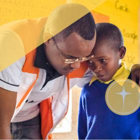 Faith and development, world vision staff speak with child