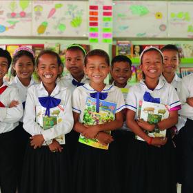 children standing in school with books