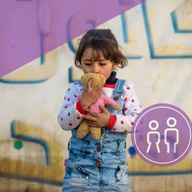 Deepen our commitment to the most vulnerable boys and girls, young child holding a teddy bear